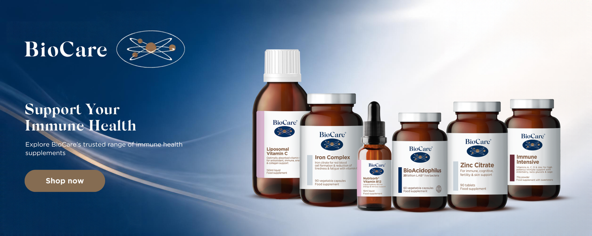BioCare supplement products displayed on a blue-to-white gradient background, including several amber glass bottles and jars with white labels and a brown 'Shop now' button on the left.