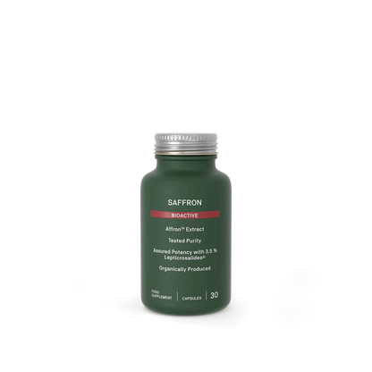 A dark green bottle of Saffron Bioactive food supplement with a silver cap, centered on a plain white background.